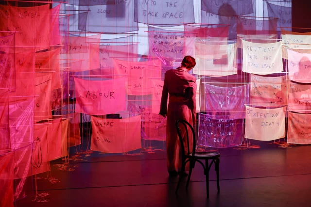 Britta performing the Chair Dance with Justine performing in video projection, Tanzfabrik Berlin, June 2021 – photo by Anja Weber