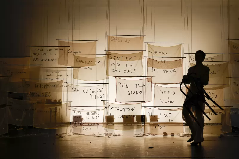 Britta entering to perform the chair dance, Tanzfabrik Berlin, June 2021 – photo by Anja Weber