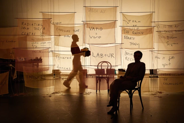 Britta performing the chair dance with William moving objects, Tanzfabrik Berlin, June 2021 – photo by Anja Weber