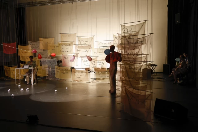 Britta performing typewriter dance with Kasia and William listening, Tanzfabrik Berlin, June 2021 – photo by Anja Weber