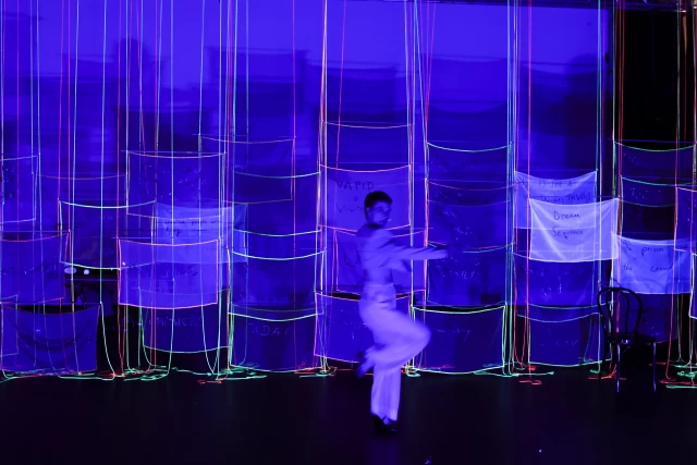 Britta performing the Steam Heat dance in blacklight, Tanzfabrik Berlin, June 2021 – photo by Anja Weber