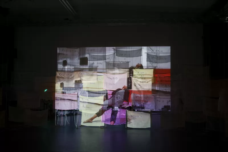 Justine performing in "V-TIP" video projection, Tanzfabrik Berlin, June 2021 – photo by Anja Weber