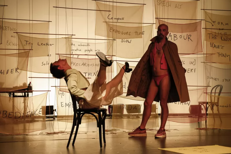 Britta performing the chair dance with William as flasher, Tanzfabrik Berlin, June 2021 – photo by Anja Weber