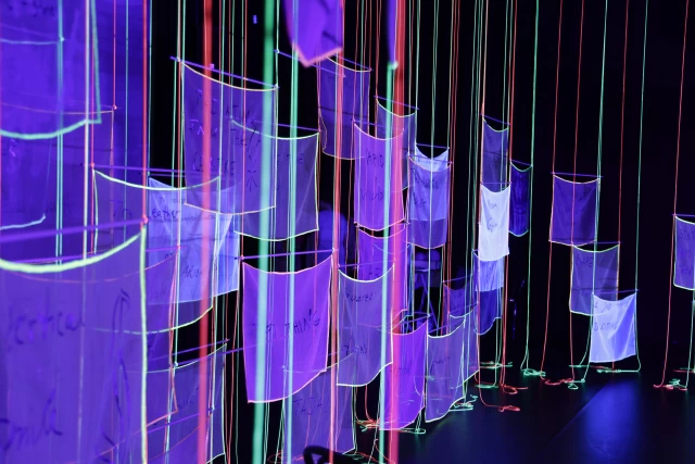 Banners in blacklight, Tanzfabrik Berlin, June 2021 – photo by Anja Weber