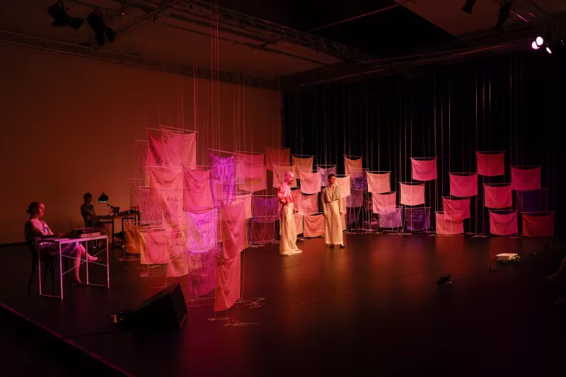 Britta and William greeting the audience with Kasia Wolinska at typewriter and Nikola Pieper at technician's desk, Tanzfabrik Berlin, June 2021 – photo by Anja Weber